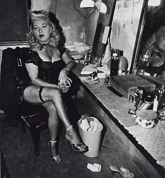 Diane Arbus - Burlesque comedienne in her dressing room, Atlantic City, NJ.